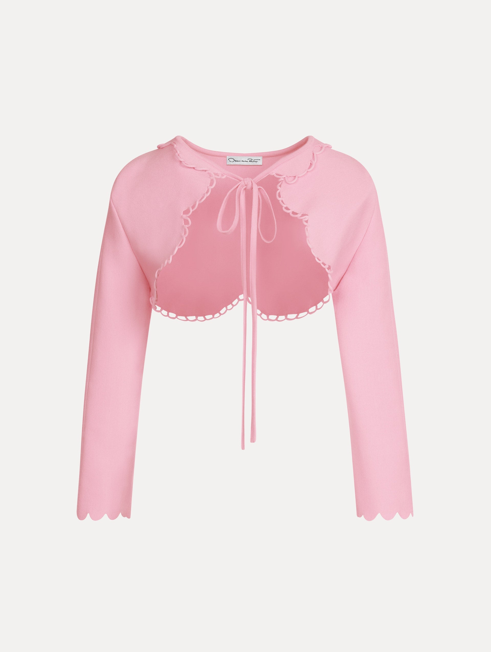 Scallop Trim Knit Bolero with tie at front in the color pink. Front View.