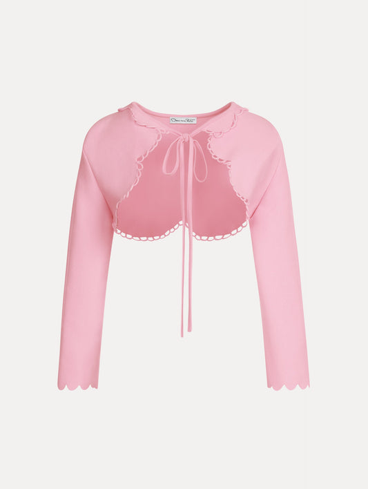 Scallop Trim Knit Bolero with tie at front in the color pink. Front View.