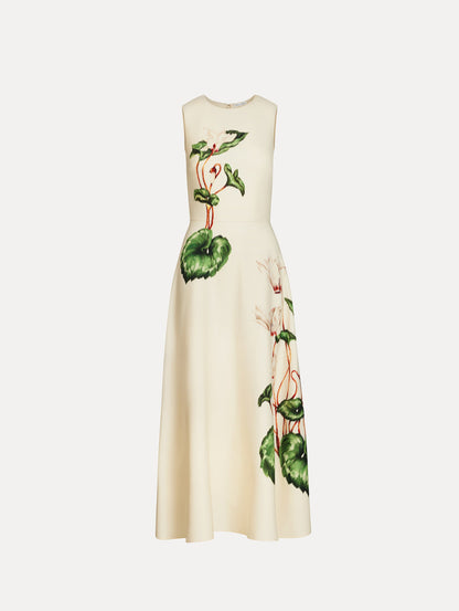Dress in an oatmeal cream color with floral print motif.