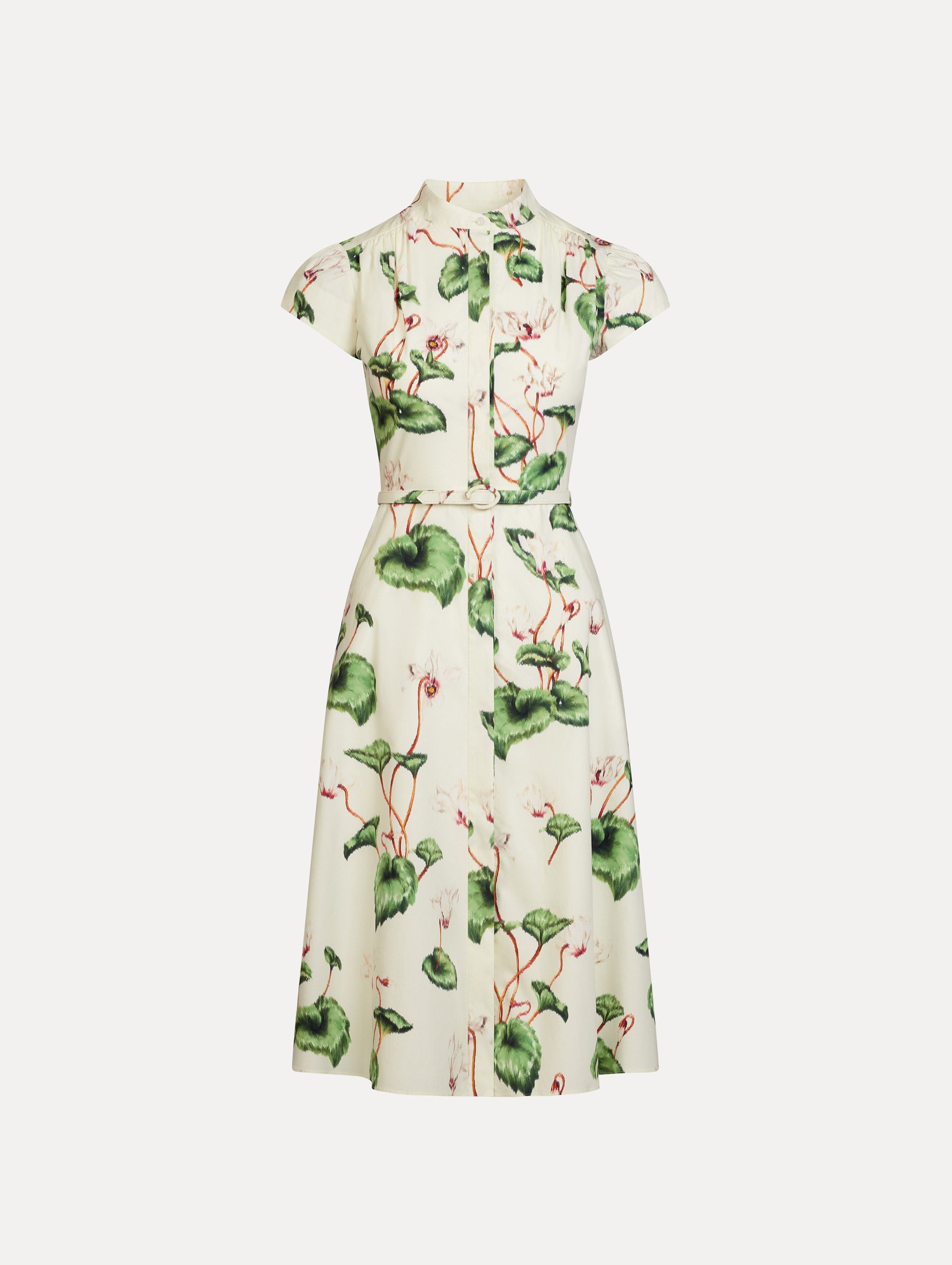 Chiné Cyclamen Cotton Poplin Cap Sleeve Dress in the colors White and Ivory, featuring a tailored bodice, flared midi skirt, short sleeves, concealed button front, matching belt at waist, and softly blurred floral print.