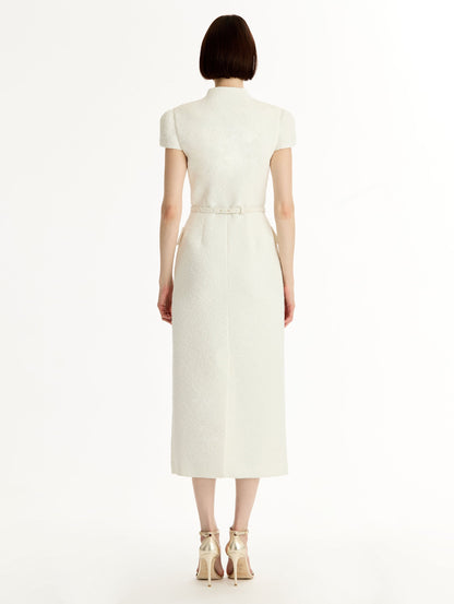 Ivory Cyclamen-Detailed Wool Tweed Dress with belted waist and floral motif gold buttons. Back View.