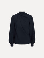 The model is wearing the Draped Georgette Blouse in the color Navy. Featuring silk georgette, a draping mock-neckline, and long, billowed sleeves. Front View.