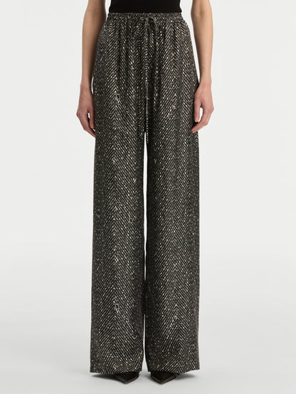Black and Ivory Chevron Silk Twill Drawstring Pant featuring a high elastic waistband and fluid, shimmering drape. Front View.