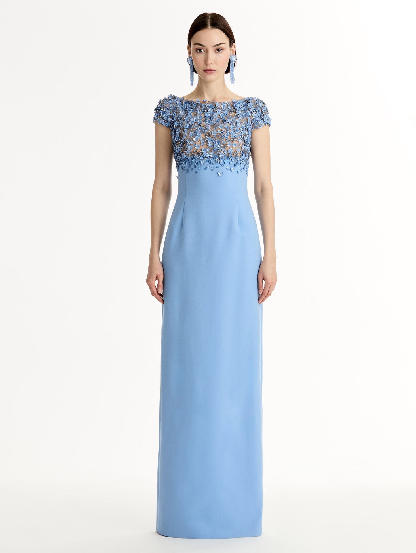 Blue floor length gown with Porcelain-flower motif on cap-sleeve bodice covered in sequins and crystals forming a delicate, petal-like lattice. Double-faced stretch wool skirt. Front View.