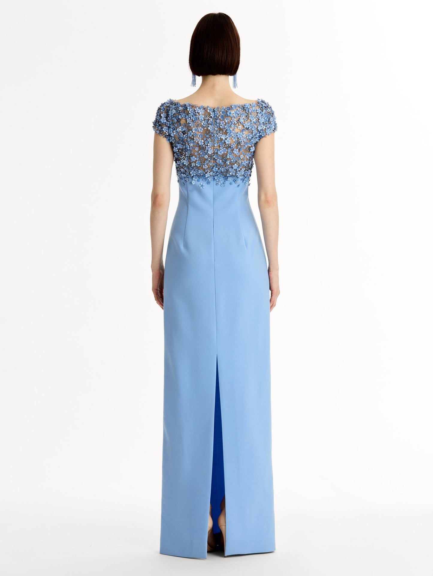 Blue floor length gown with Porcelain-flower motif on cap-sleeve bodice covered in sequins and crystals forming a delicate, petal-like lattice. Double-faced stretch wool skirt. Back View.