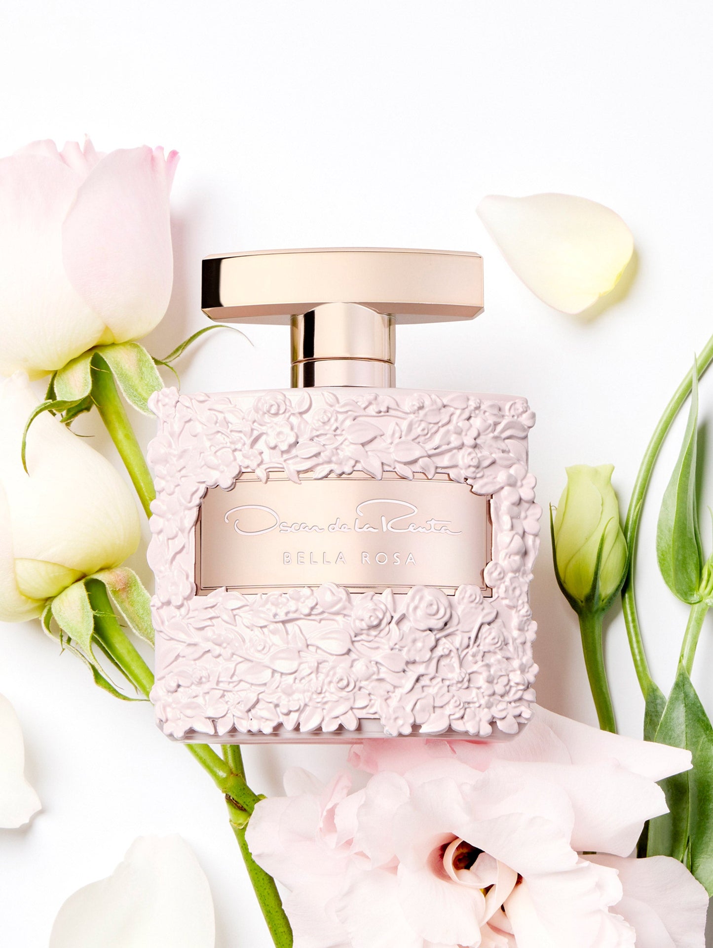 Oscar Bella Rosa Pink Roses Perfume Bottle with Flowers behind the bottle Front View