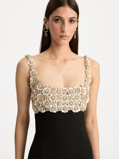 Black Embroidered Sleeveless Gown with a form fitting, floor length silhouette and an embellished bodice. Zoom View.