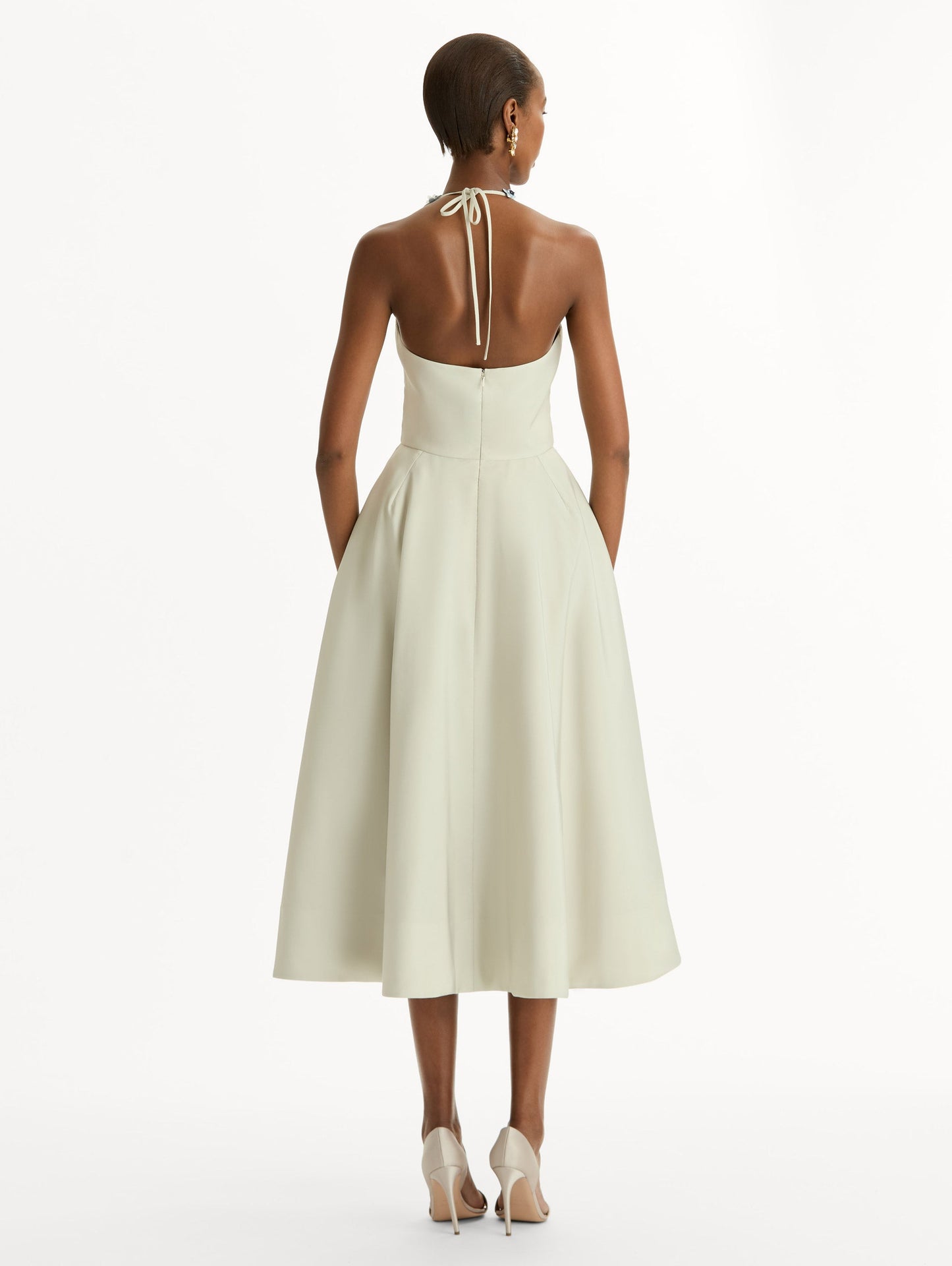 Porcelain flower-printed faille cocktail midi dress with floral appliqué halter neckline. Fitted bodice and full skirt. Back View.