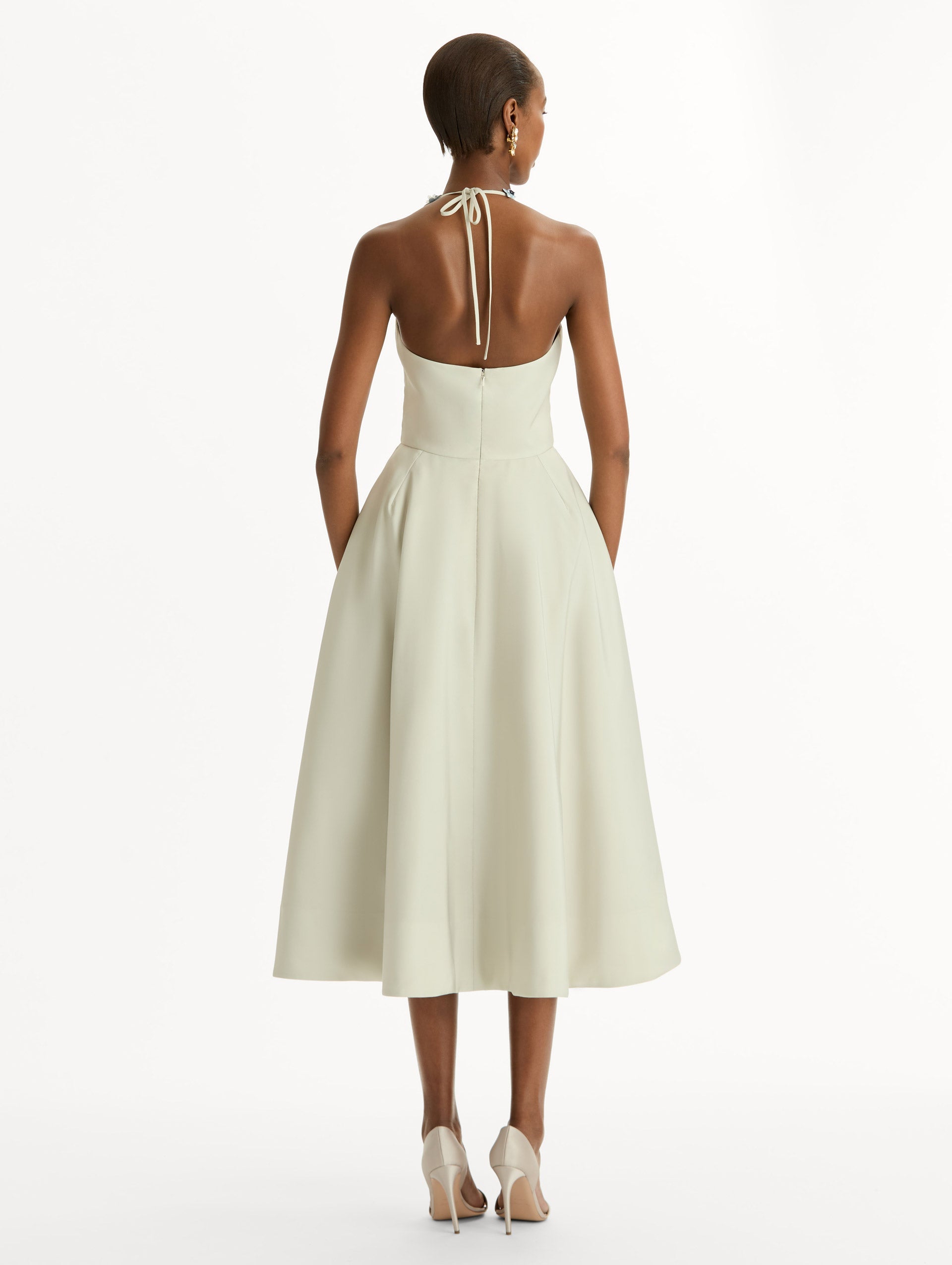 Porcelain flower-printed faille cocktail midi dress with floral appliqué halter neckline. Fitted bodice and full skirt. Back View.