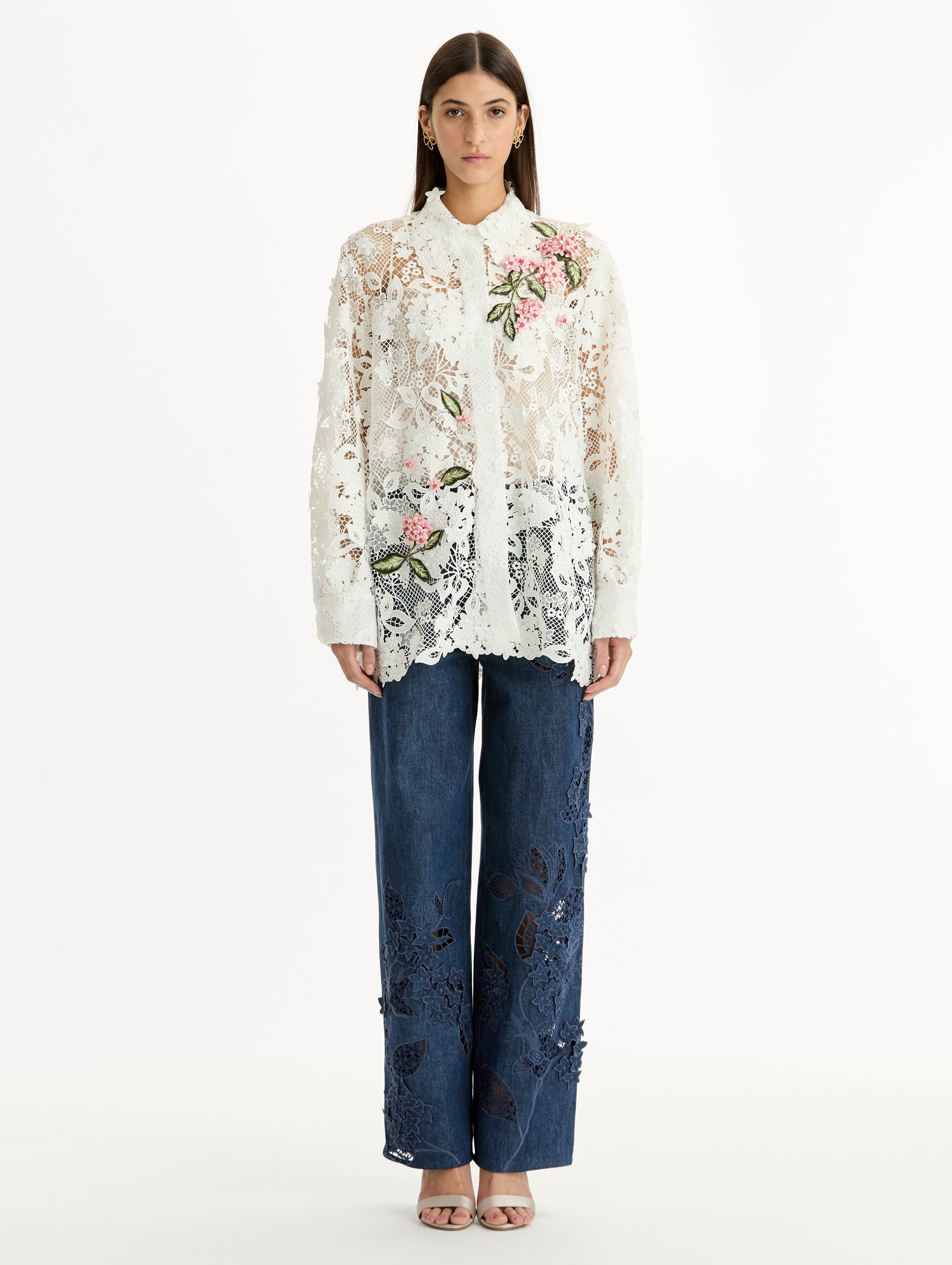 Long Sleeve, Button Up Blouse with Delicate guipure lace and intricate porcelain flower embroidery. White with pink florals. Front View.