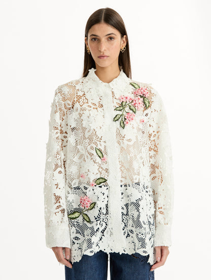 Long Sleeve, Button Up Blouse with Delicate guipure lace and intricate porcelain flower embroidery. White with pink florals. Front View.