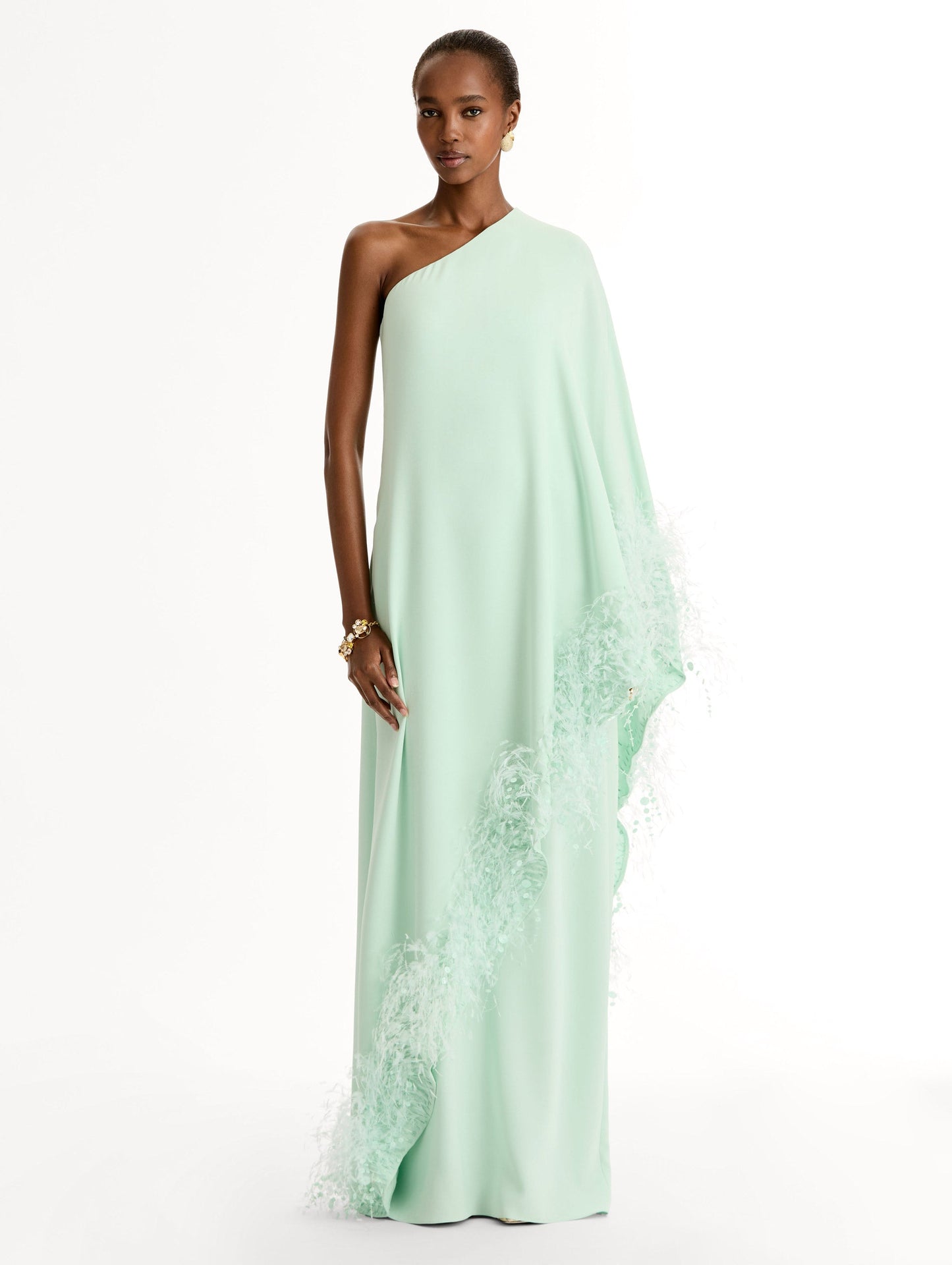 One-shoulder caftan with point d’esprit feather embroidery. Front View.