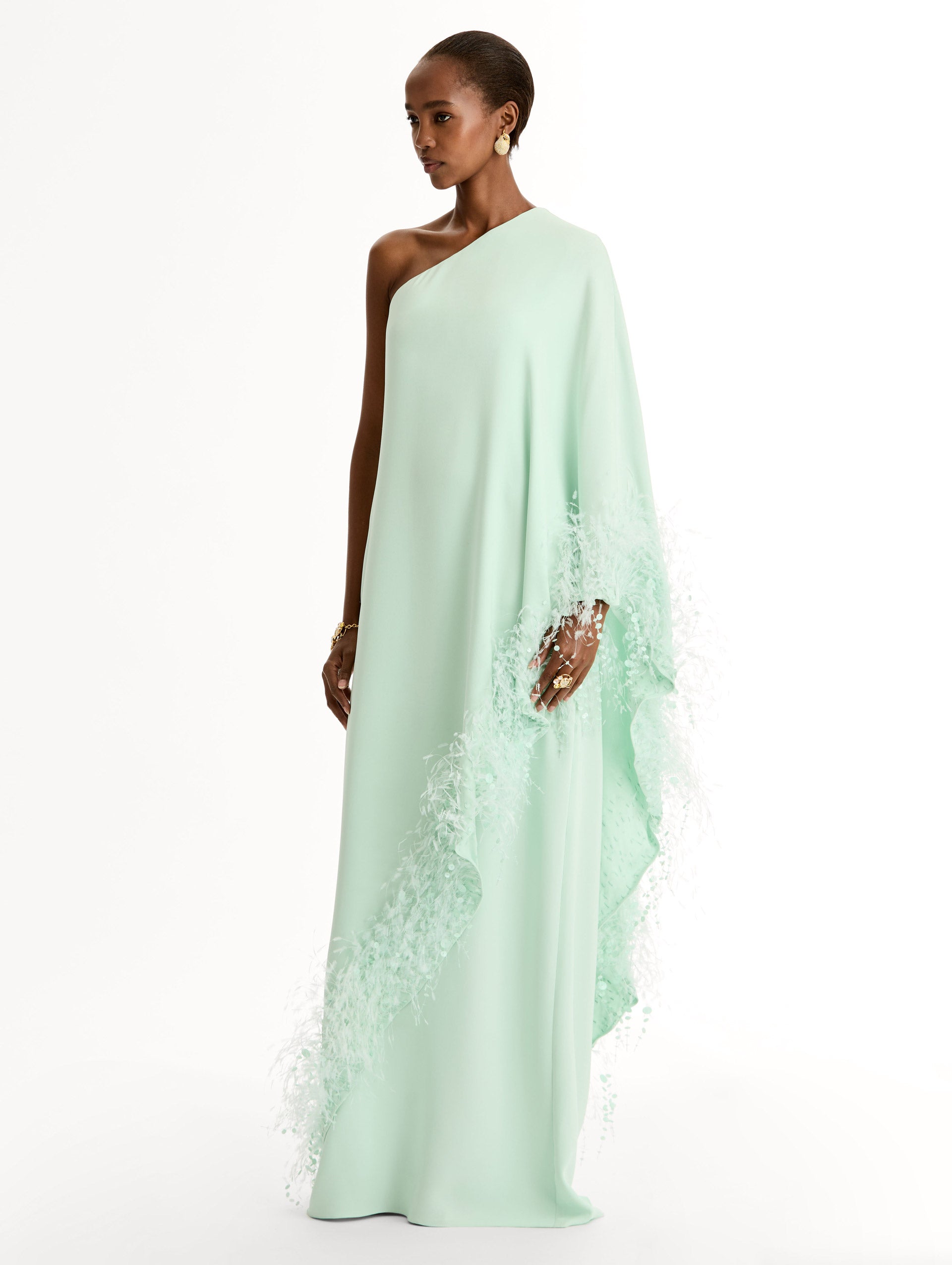 One-shoulder caftan with point d’esprit feather embroidery. Side View.