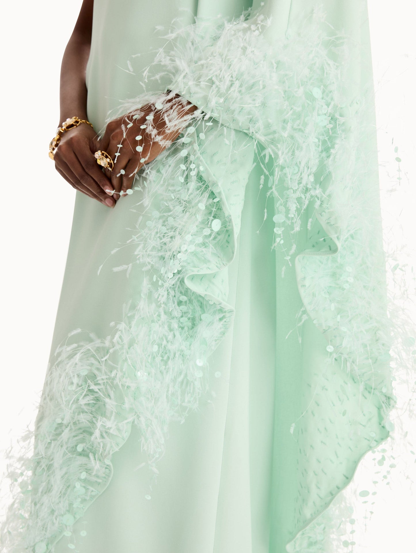 One-shoulder caftan with point d’esprit feather embroidery. Close Up Side View.