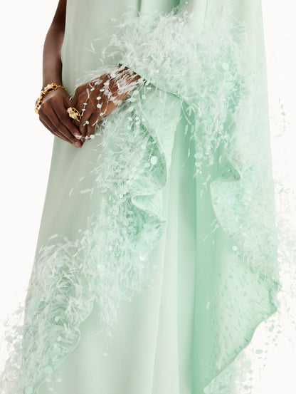 One-shoulder caftan with point d’esprit feather embroidery. Close Up Side View.