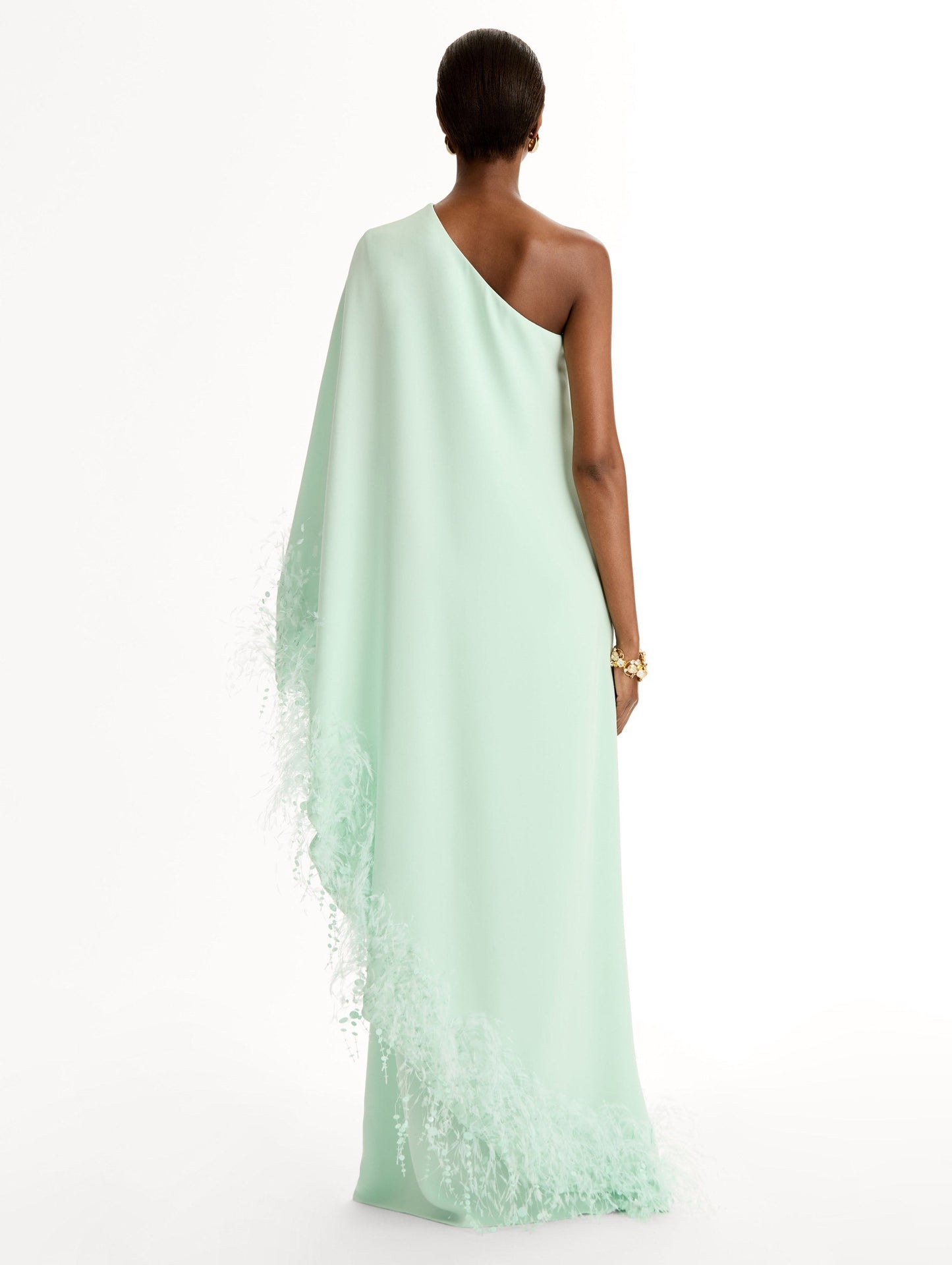 One-shoulder caftan with point d’esprit feather embroidery. Back View.