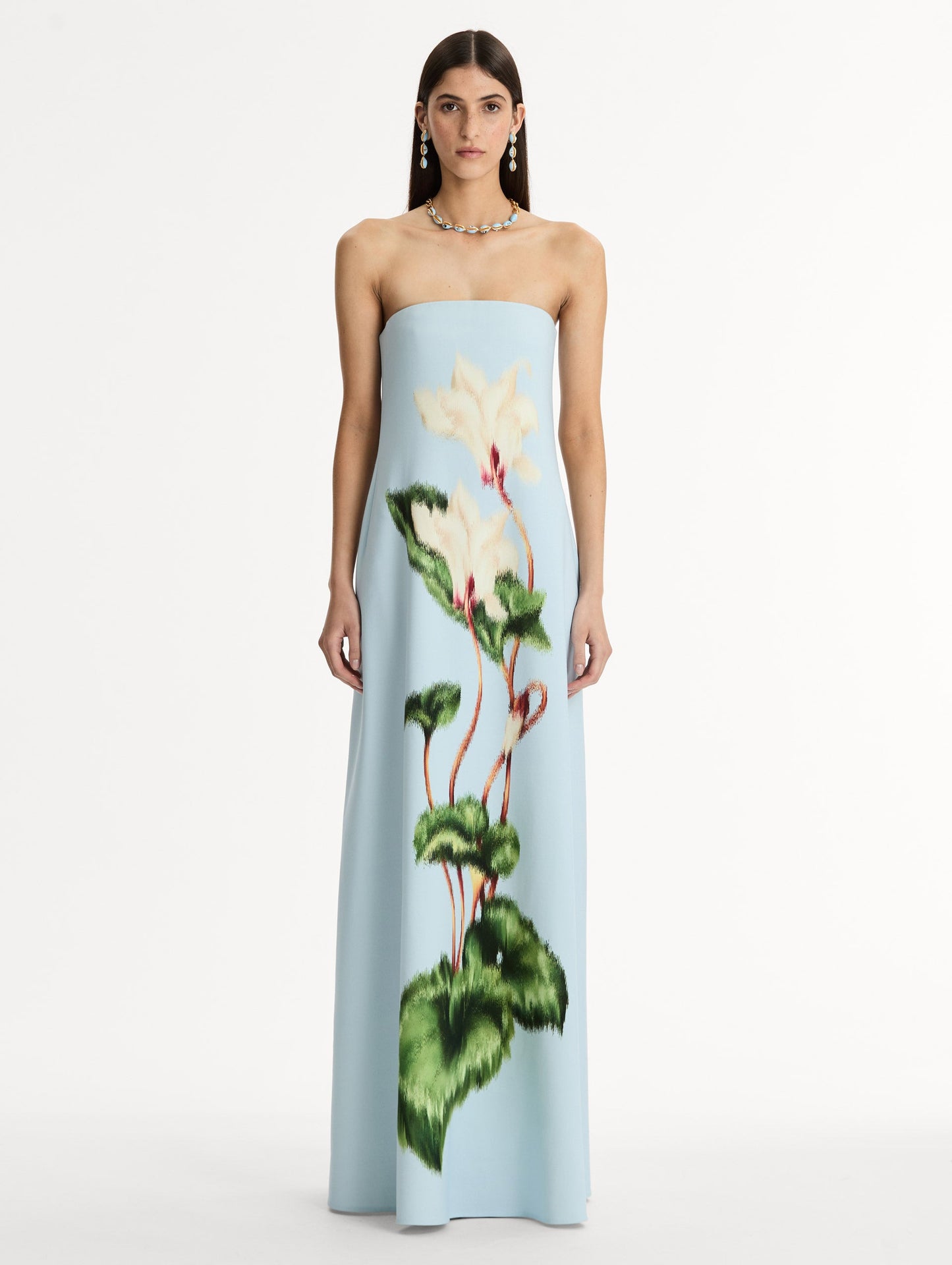 Strapless Floor Length Gown in Pale Blue with trapeze silhouette. Chiné Cyclamen motif blooms with blurred edges. Front View.