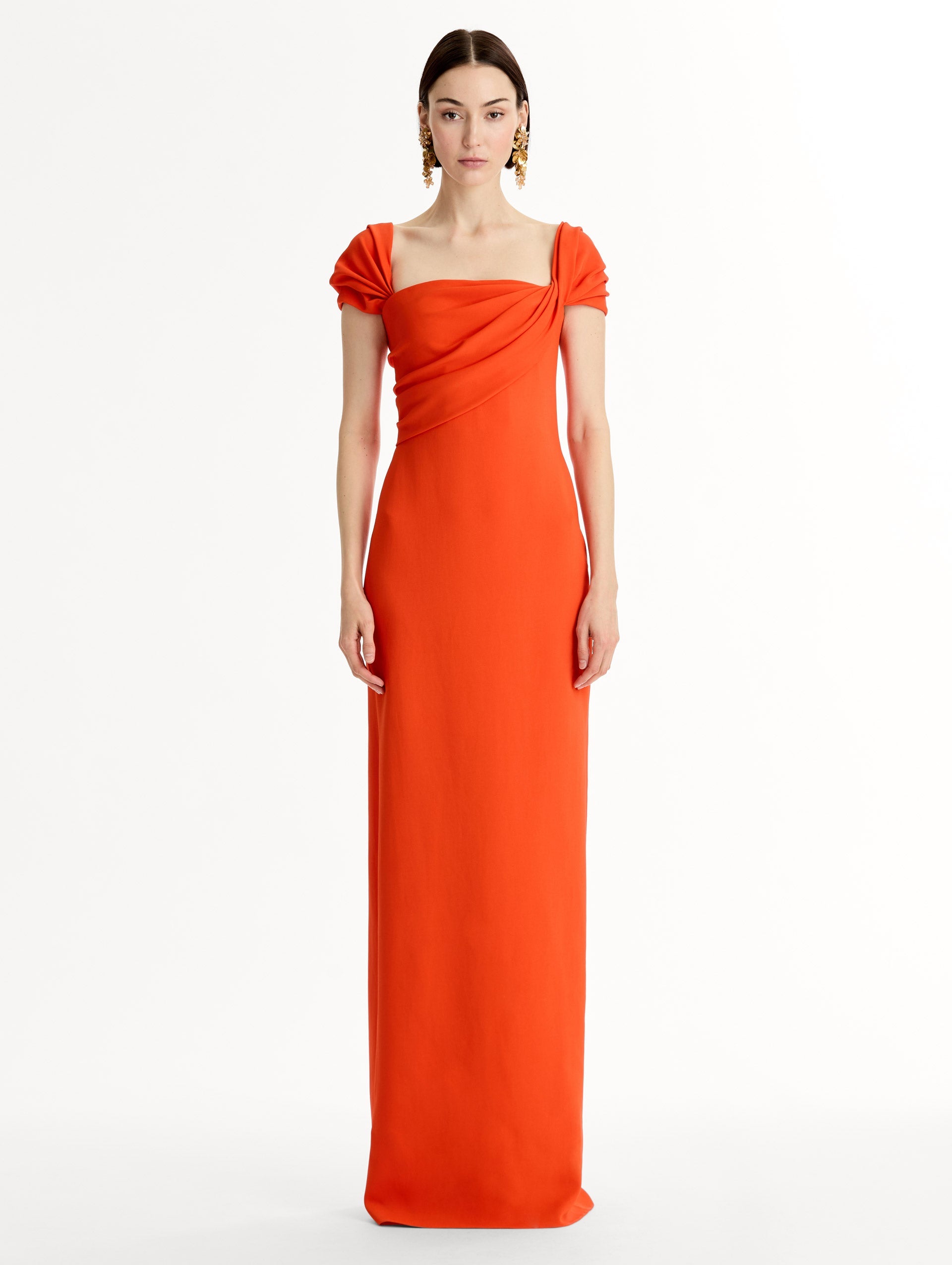 Fluid stretch cady gown with sculptural draping along neckline and shoulders. Short sleeve, column silhouette . Front View.