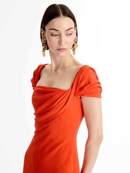 Fluid stretch cady gown with sculptural draping along neckline and shoulders. Short sleeve, column silhouette . Side View.