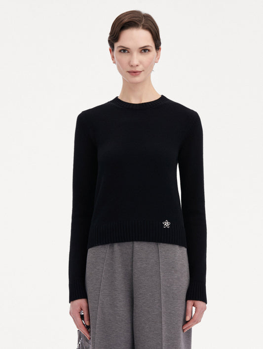 Black O Flower Cashmere Pullover Paired with Grey Trousers Front View