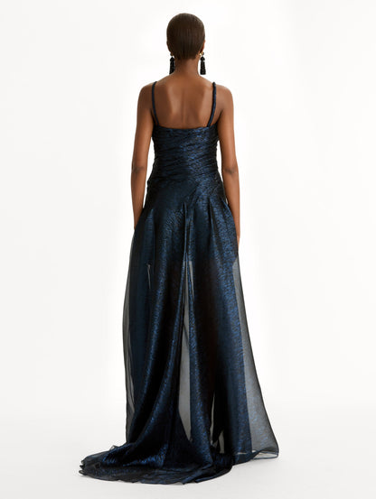 Navy Lamé Mousseline Draped Gown with gold butterfly hardware on the shoulder and asymmetric draped bodice. Back View.