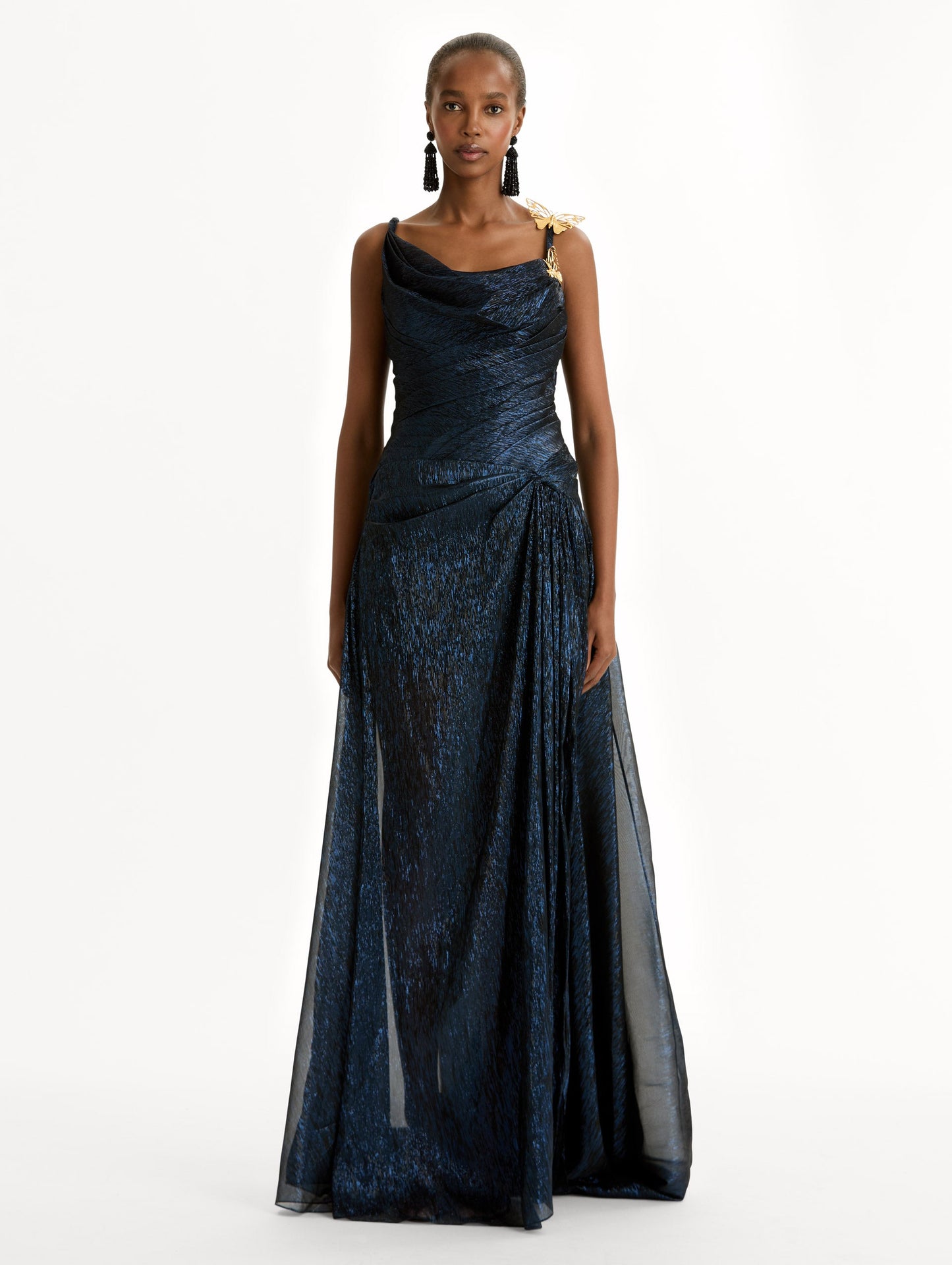 Navy Lamé Mousseline Draped Gown with gold butterfly hardware on the shoulder and asymmetric draped bodice. Front View.