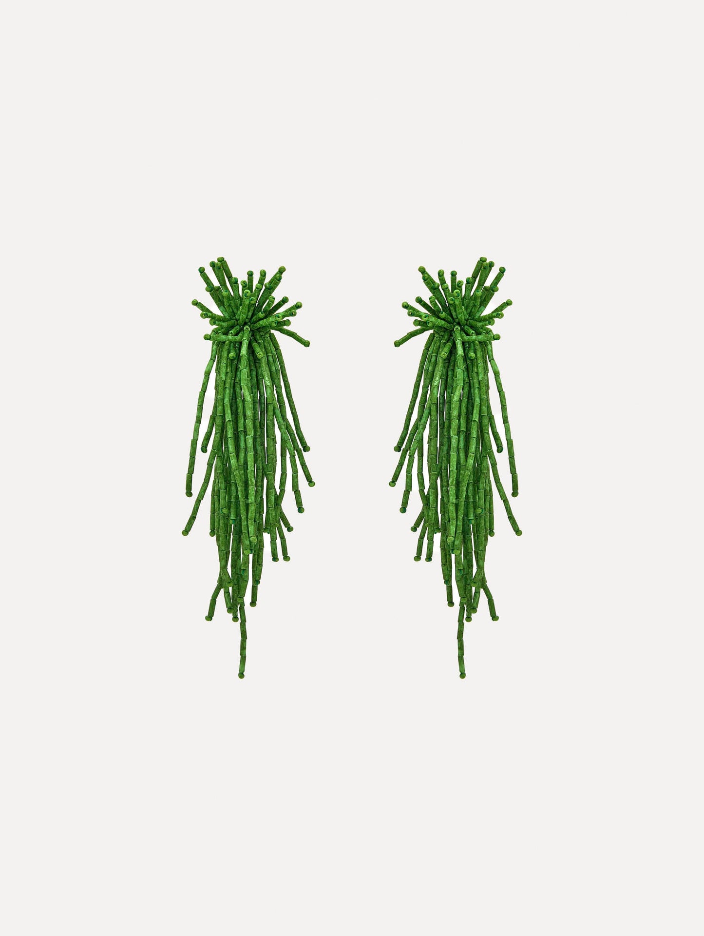 The Firework Tassel Earrings in the color fern.