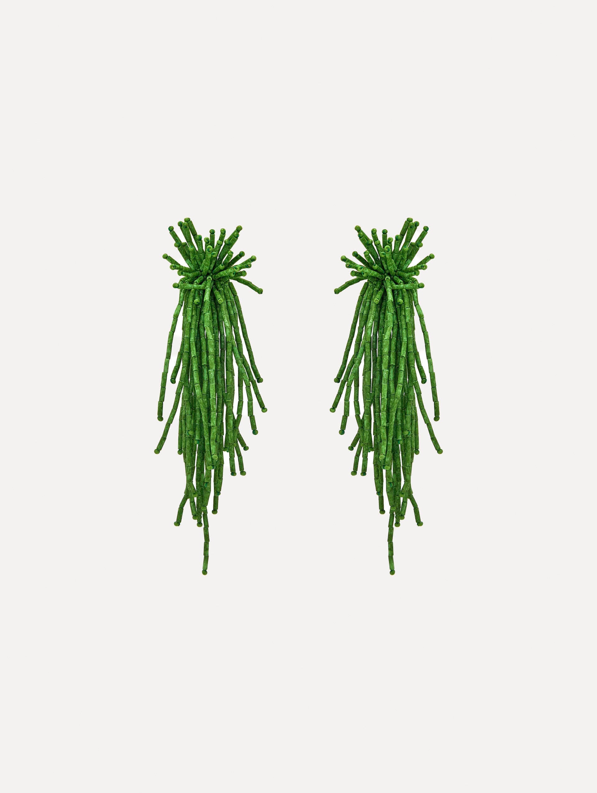 The Firework Tassel Earrings in the color fern.
