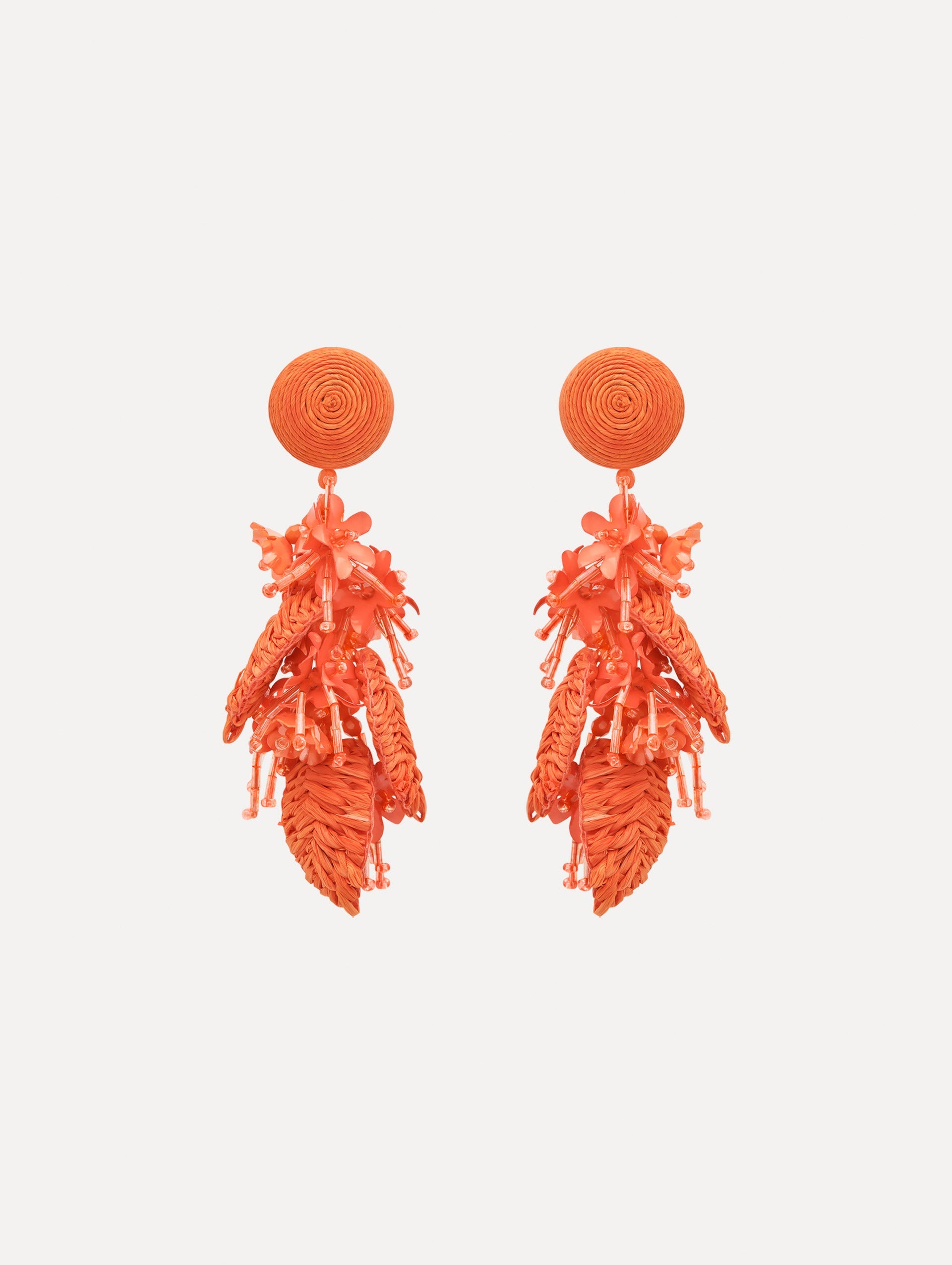 The Raffia Tassel Bouquet Clip-On Earrings in Orange. Front View.