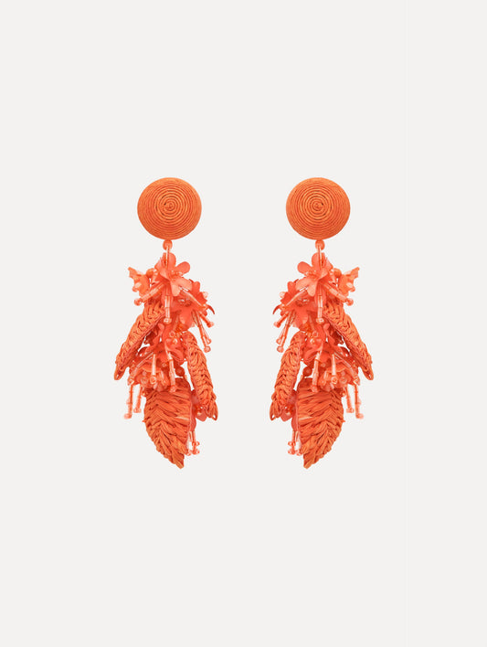 The Raffia Tassel Bouquet Clip-On Earrings in Orange. Front View.