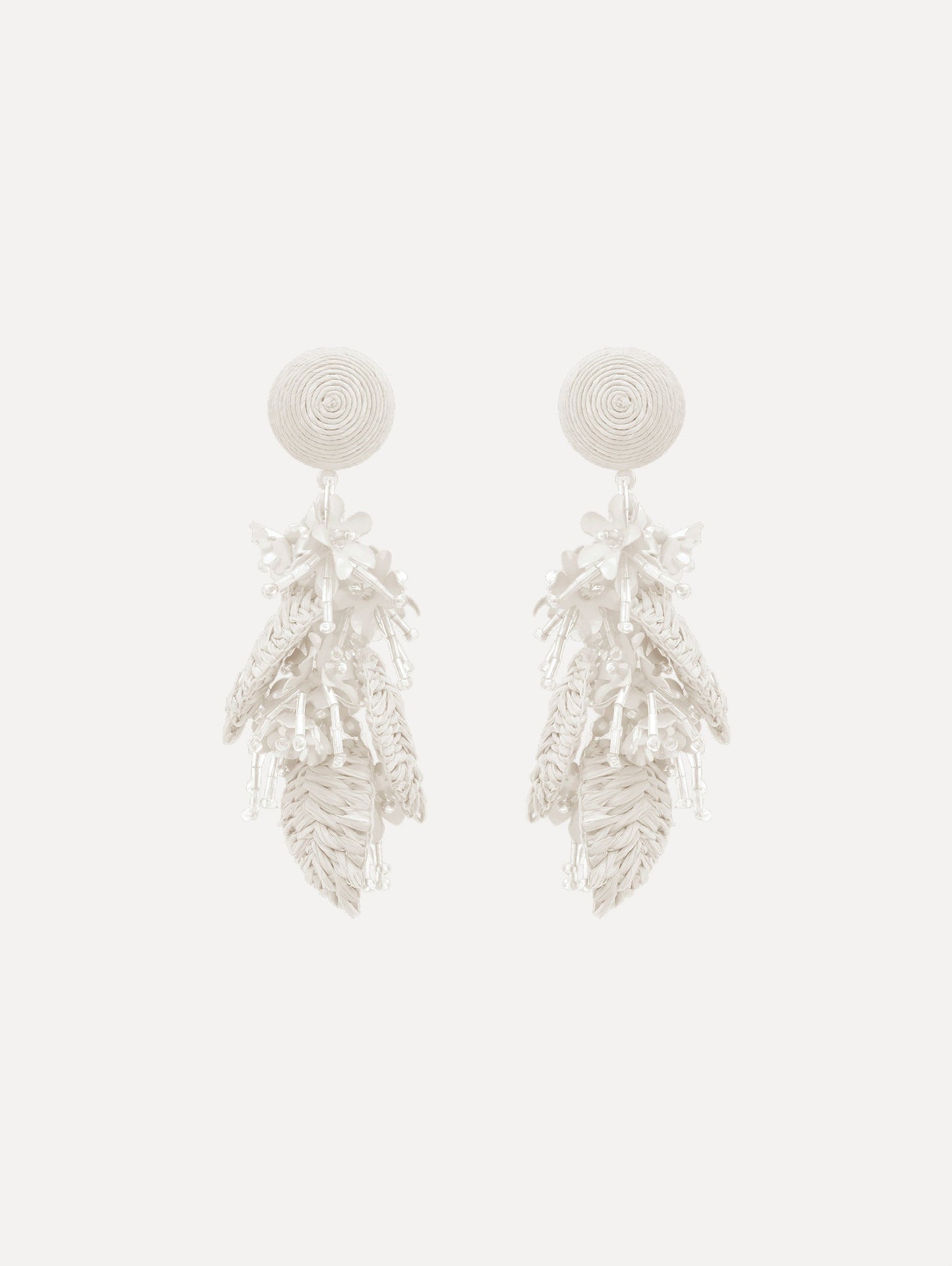 The Raffia Tassel Bouquet Clip-On Earrings in White. Front View.