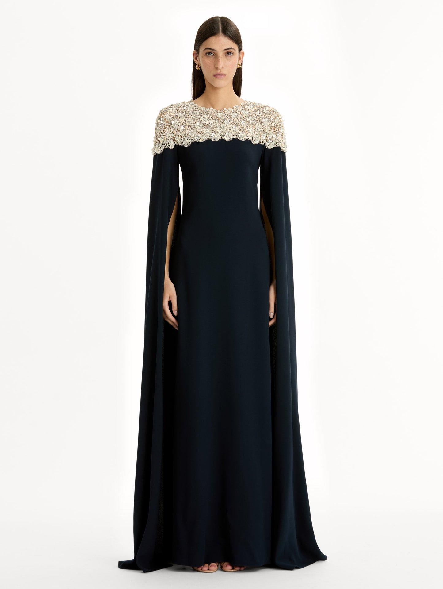 Navy Embroidered Caftan with ivory embroidered neckline and floor-length draped silhouette. Front View.
