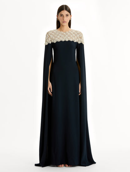 Navy Embroidered Caftan with ivory embroidered neckline and floor-length draped silhouette. Front View.
