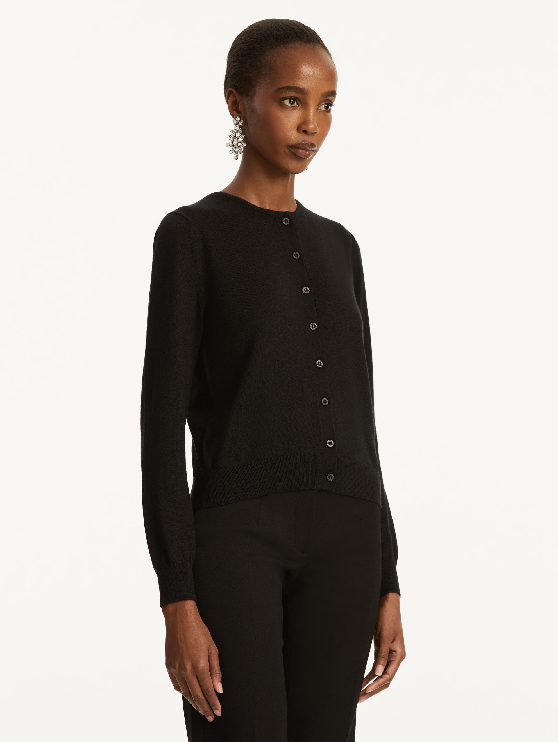 Wool-Blend Black Button-Down Cardigan Styled with Black Pants Side View