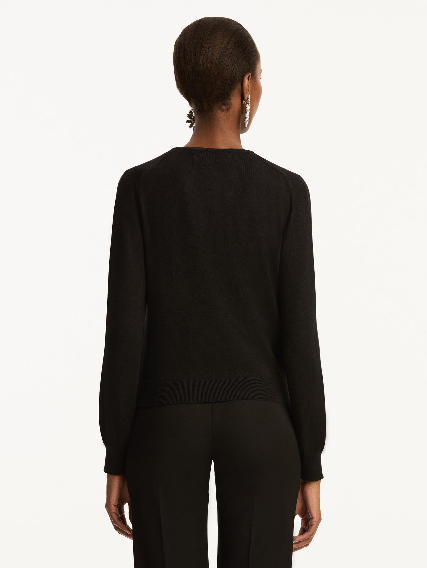 Wool-Blend Black Button-Down Cardigan Styled with Black Pants Back View