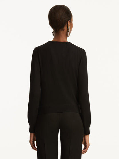 Wool-Blend Black Button-Down Cardigan Styled with Black Pants Back View