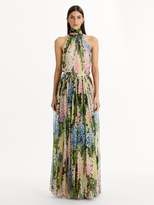 Floral Foxglove Chiffon Dress with high halter neck and pleated flowing chiffon skirt sinched at the waist. Front View.