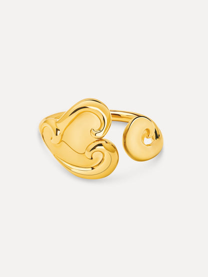 Gold Swirl Heart Cuff Bracelet featuring a sculpted heart motif with fluid, swirling details.
