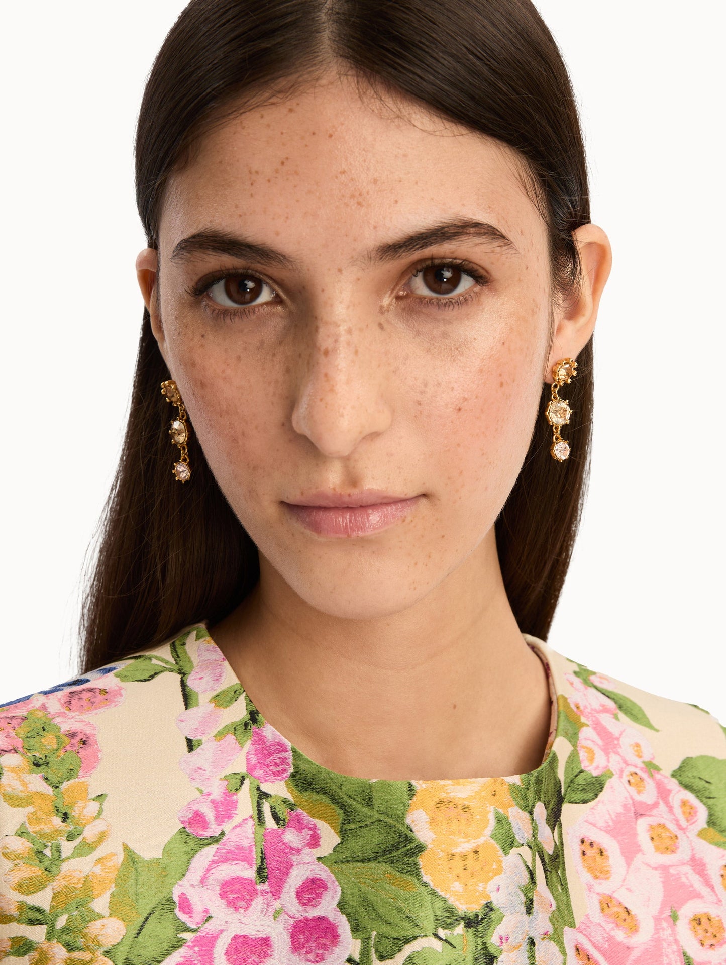 Faceted Crystal Drop Earrings with floral studs, round champagne crystals, and pale pink crystal accents. Front View.