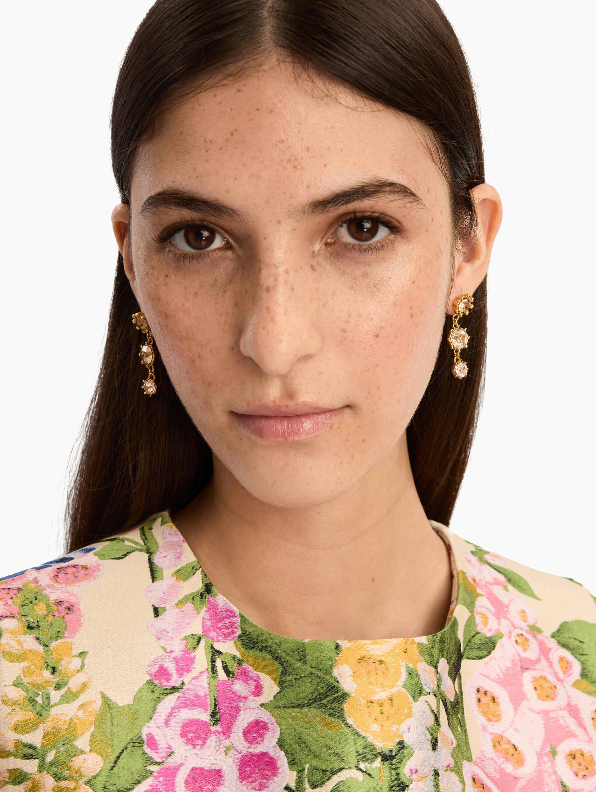Faceted Crystal Drop Earrings with floral studs, round champagne crystals, and pale pink crystal accents. Front View.