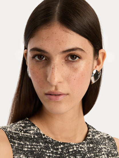 Silver Heart Clip-On Earrings with a smooth finish. Front View.