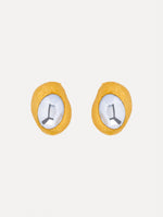 Gold Hammered Oval Clip-On Earrings featuring round textured frames with faceted silver-tone centers.
