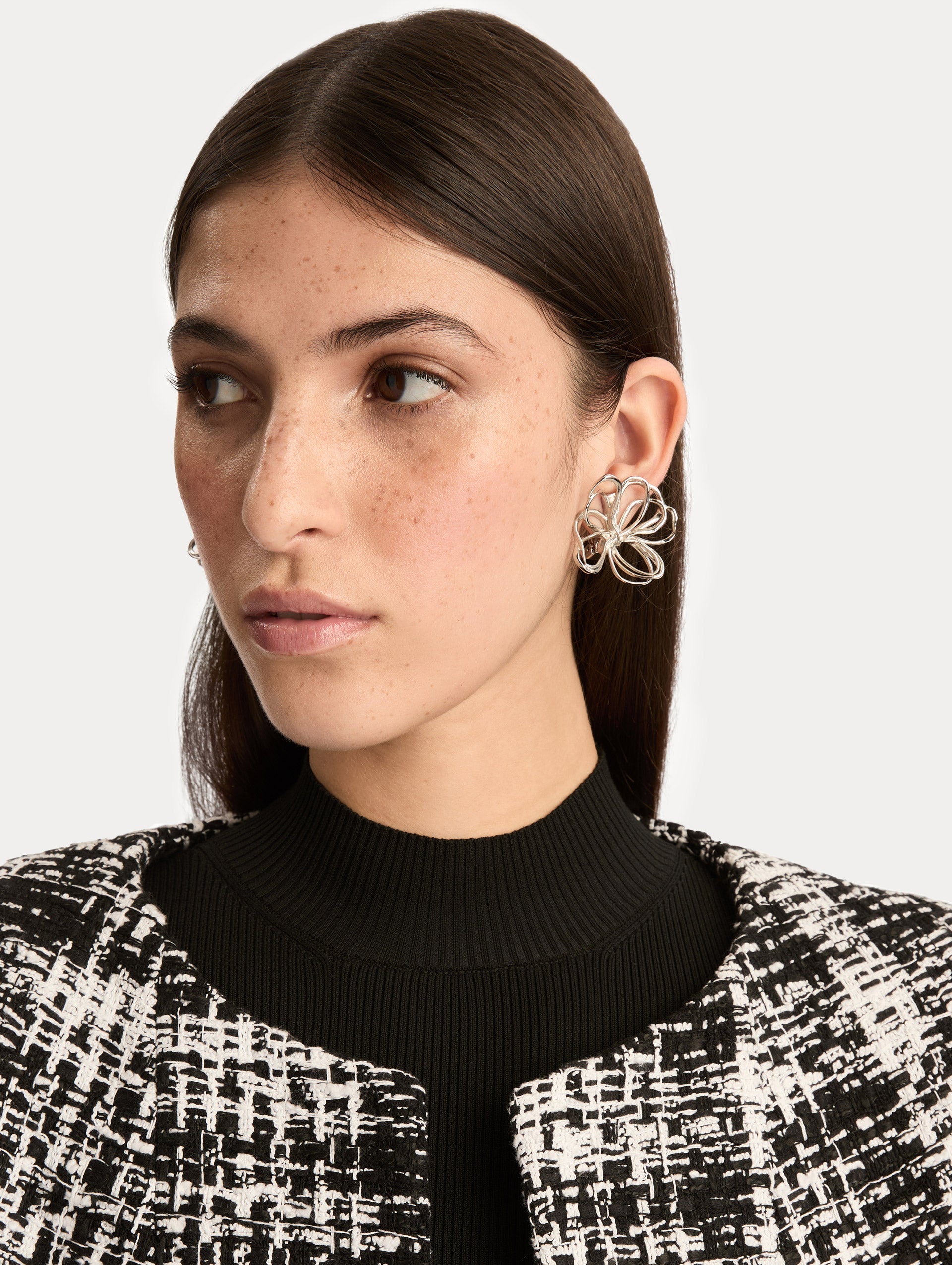 Silver Threaded Flower Earrings featuring openwork looping design. Front View.