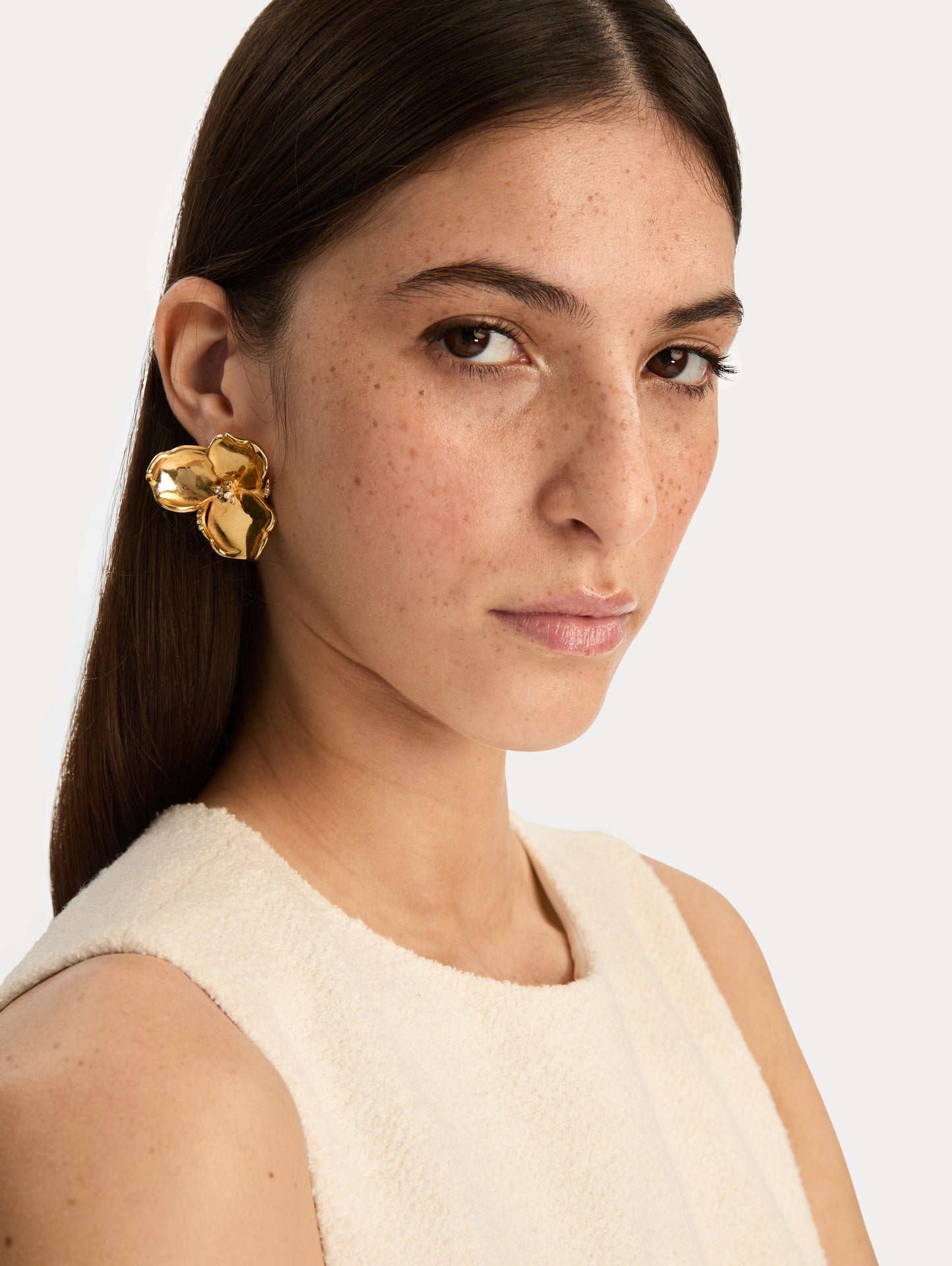 Gold Blossom Earrings featuring petal design with crystal centers. Front View.