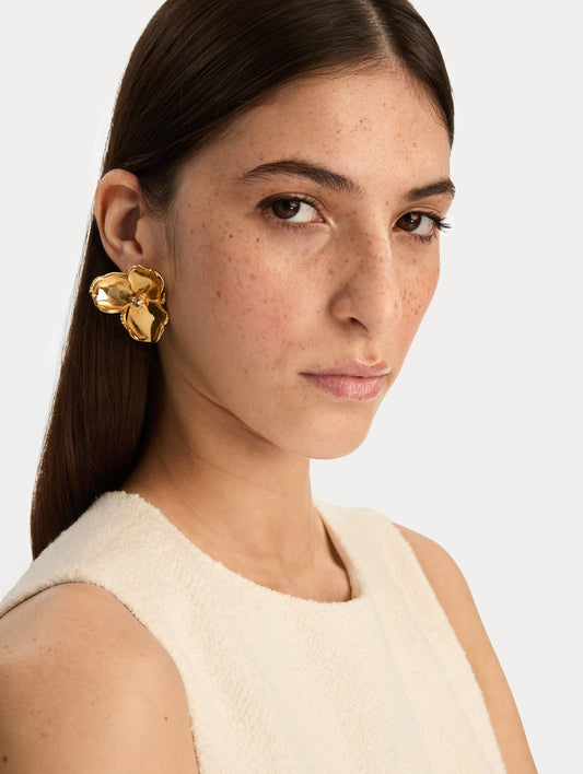 Gold Blossom Earrings featuring petal design with crystal centers. Front View.