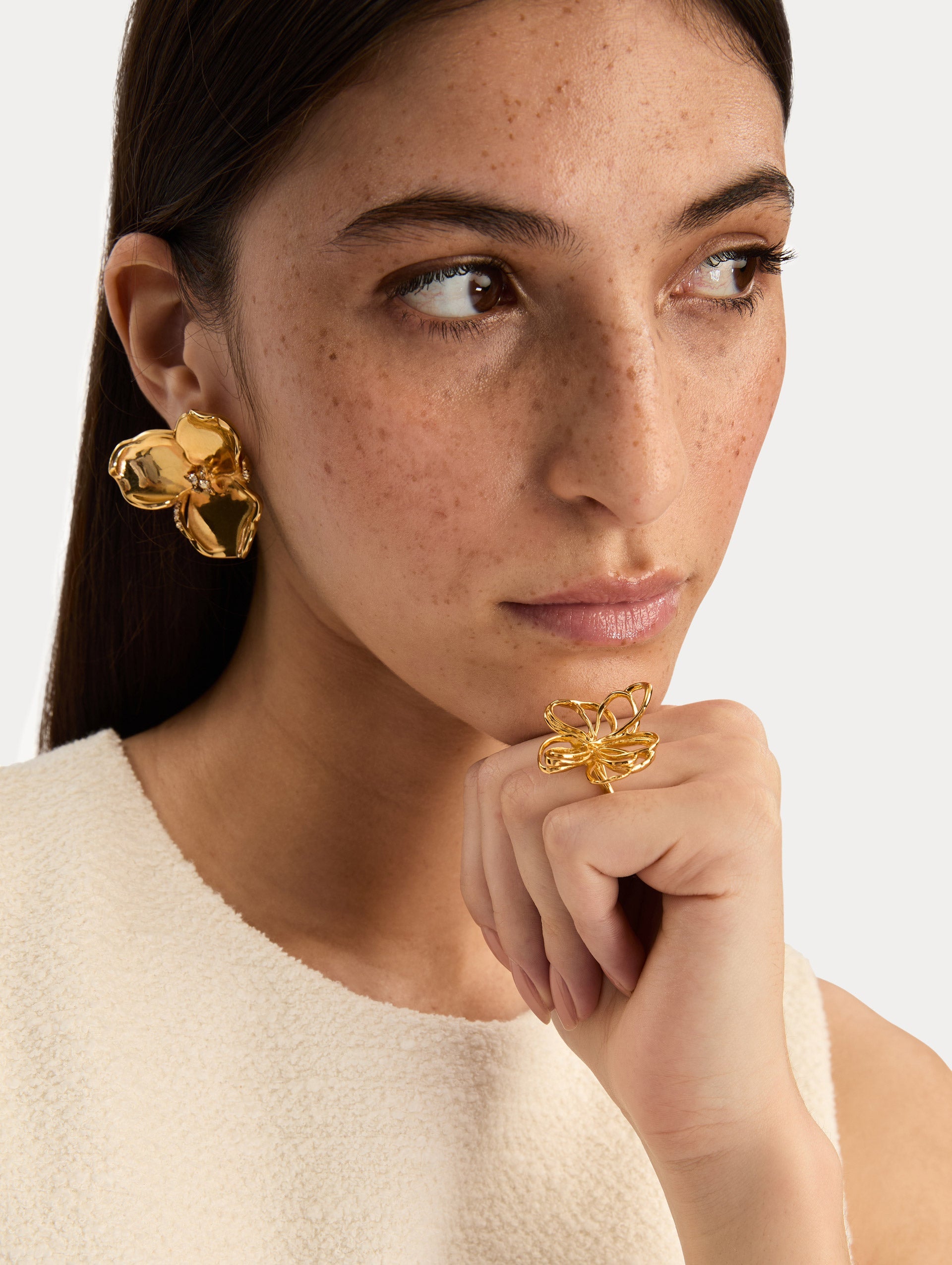 Gold Blossom Earrings featuring petal design with crystal centers. Front View.