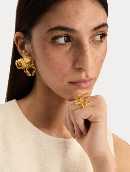 Gold Blossom Earrings featuring petal design with crystal centers. Front View.