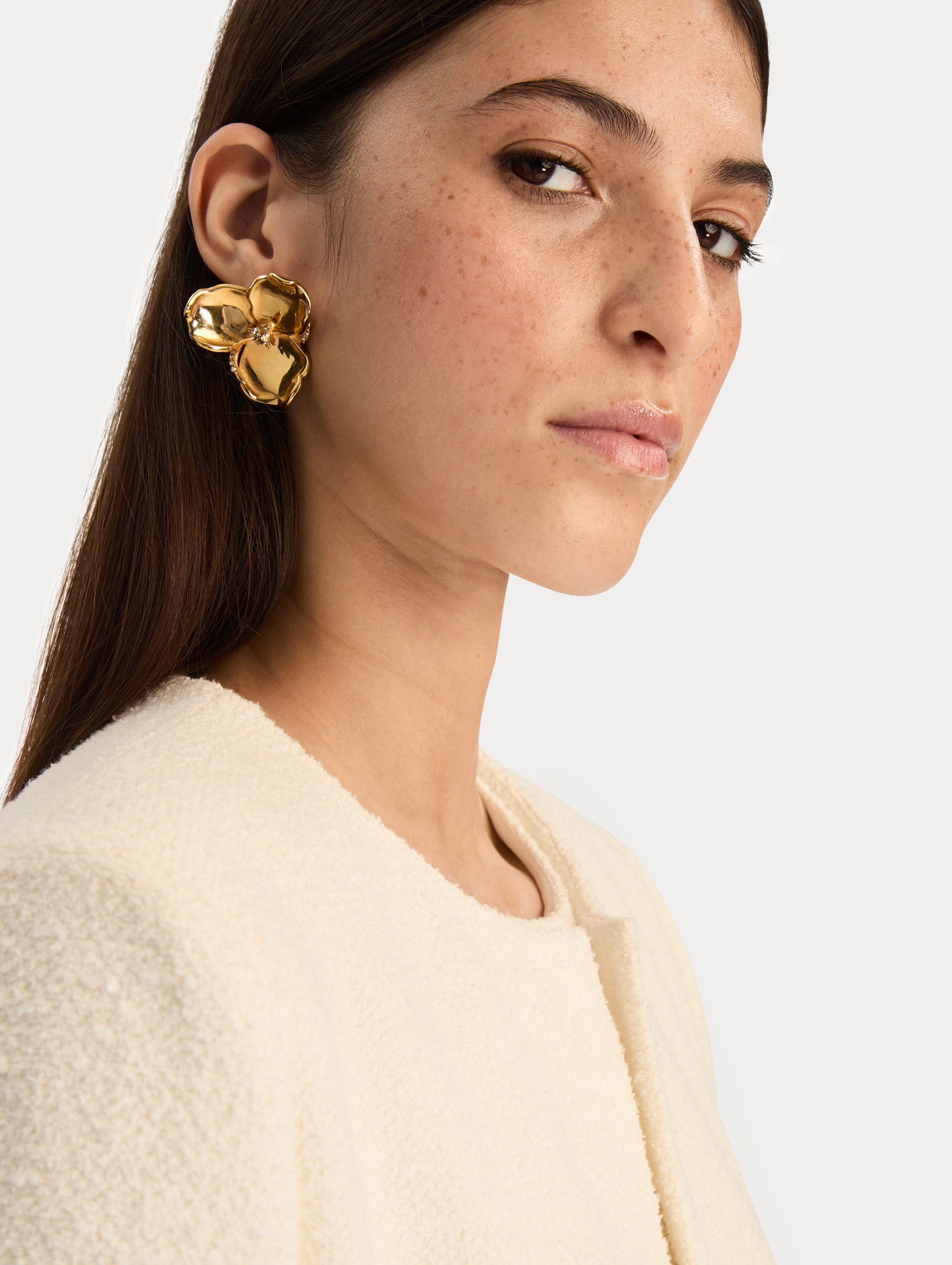 Gold Blossom Earrings featuring petal design with crystal centers. Front View.