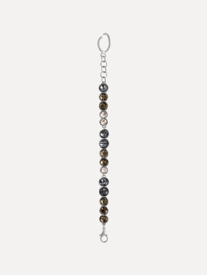 Gradient Rhinestone Strand Bracelet featuring a row of round, clear and smoky grey stones and an open circular clasp. Front View.