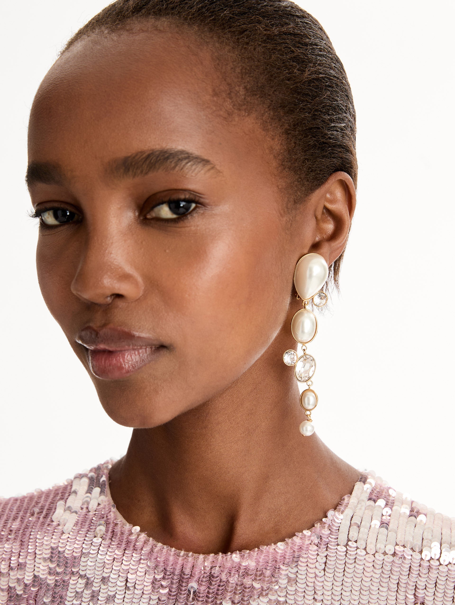 Pearls & Rhinestones Drop Clip-On Earrings with four pearls and three crystals cascading down. Front View.